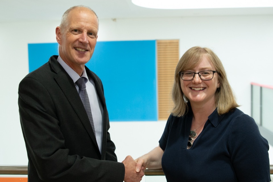 Dstl Chief Science and Technology Officer Prof Andy Bell congratulates Laura Jones on her fellowship to the Royal Academy of Engineering