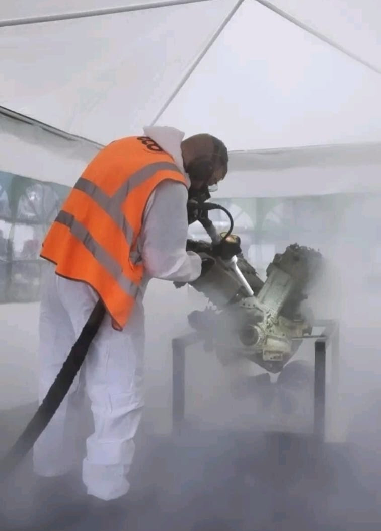 Steven McCreadie, of Eco Group, cleaning the engine with the company’s dry ice solution