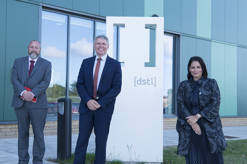 Dstl's Mike Smith CTS Lead, Dstl's Chief Executive Gary Aitkenhead and Home Secretary Priti Patel