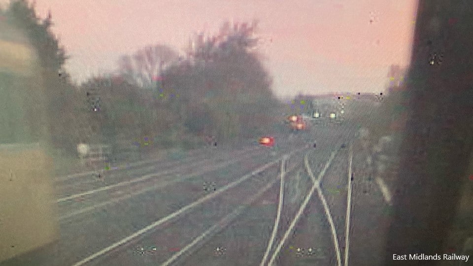 CCTV image from the rear of the train of empty coaches, showing the rail grinding train, travelling towards the junction, on the left (courtesy of East Midlands Trains)