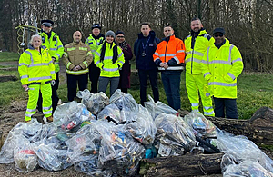 Some of the volunteers from the M6 Junction 10 scheme, teachers and community officers who cleaned up the play area