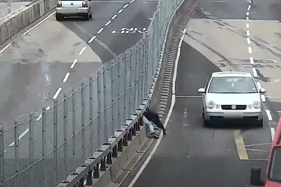 CCTV footage shows a pedestrian squeezing through a small gap in the steel, central reservation fencing along the busy A63 in Hull city centre