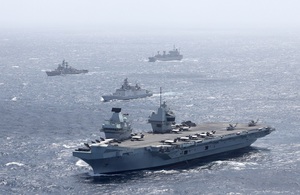 HMS Queen Elizabeth of UK Carrier Strike Group in company with an Indian Shivalik Multi-role Frigate during Maritime Partnership Exercises in the Bay of Bengal