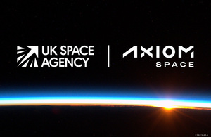 The UK Space Agency and Axiom Space logos, seen from space with the sun rising in the background